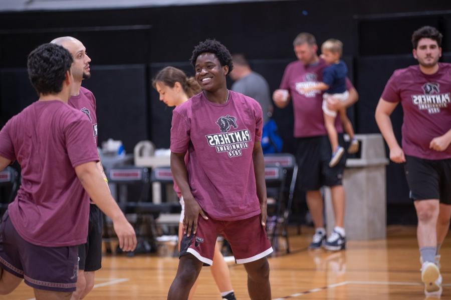 Happy ACPHS alumni play a basketball game during alumni weekend